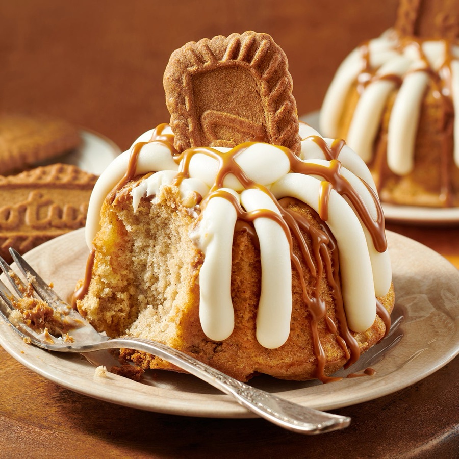 A Biscoff cookie butter bundtlet with a bite taken